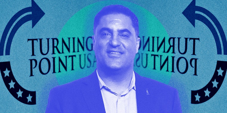 Cenk Uygur in front of turning point logo